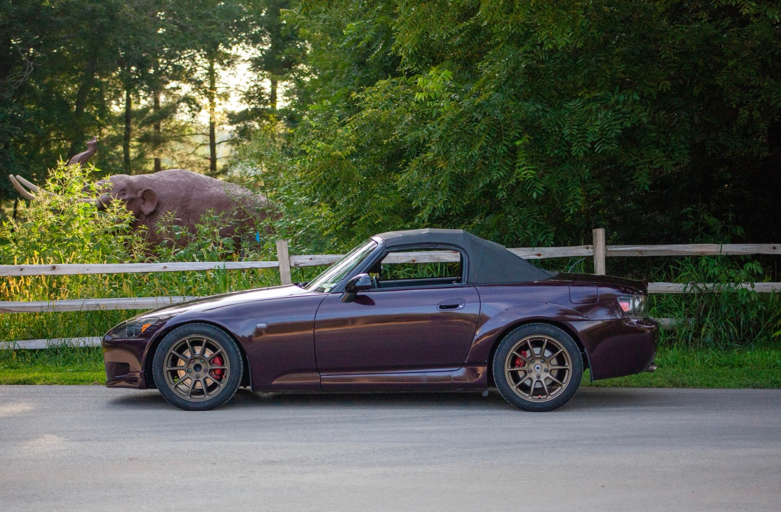 Full side profile of a purple Honda S2000